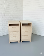 Load image into Gallery viewer, Two wooden desk draws against a white brick wall.