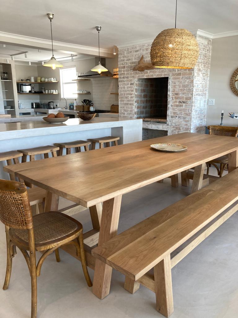 The Chobe A-Leg Table is a classic solid hardwood trestle dining table with a distinctive A-leg base. Custom sizes and finishes available. Made to order.