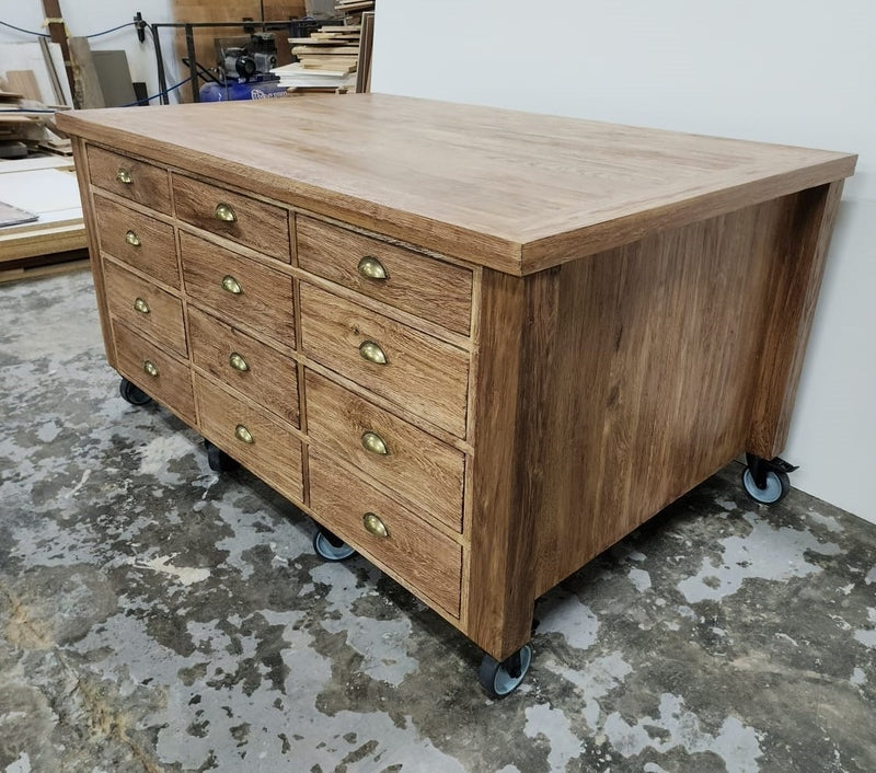 Custom Made wooden kitchen island on wheels with multiple draws.