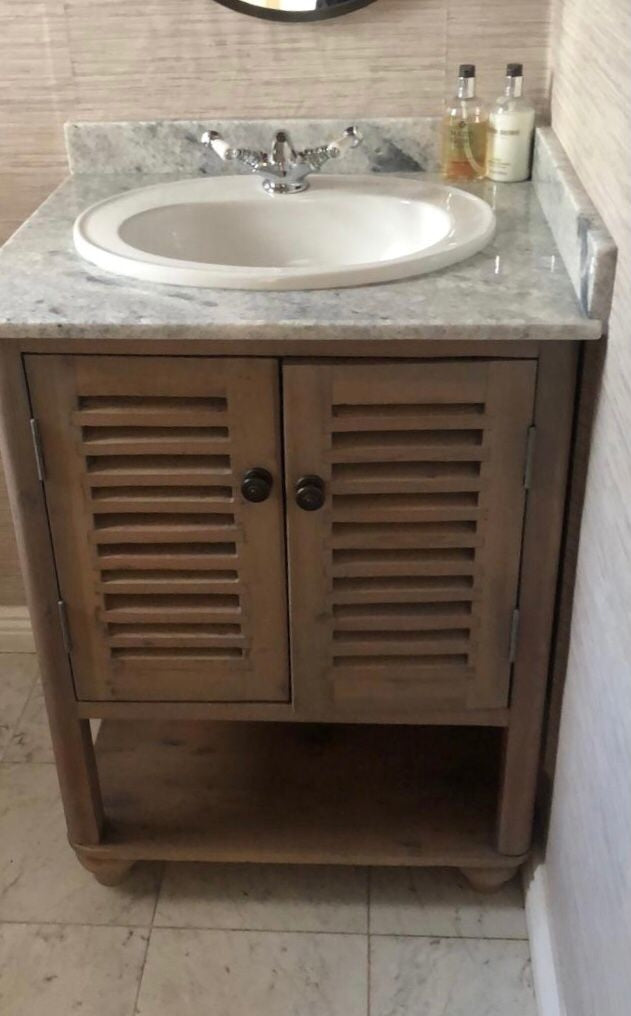 Custom made bathroom vanity with french style wooden doors. 