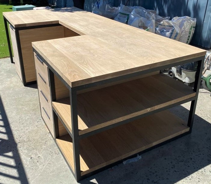 Custom made kitchen island with black metal legs and side storage.