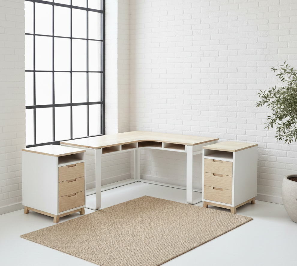 The Kiki L-Shape Desk features a solid Ash timber top on a matte black flat-bar steel frame with under-desk cubbies. Custom made to order in South Africa.