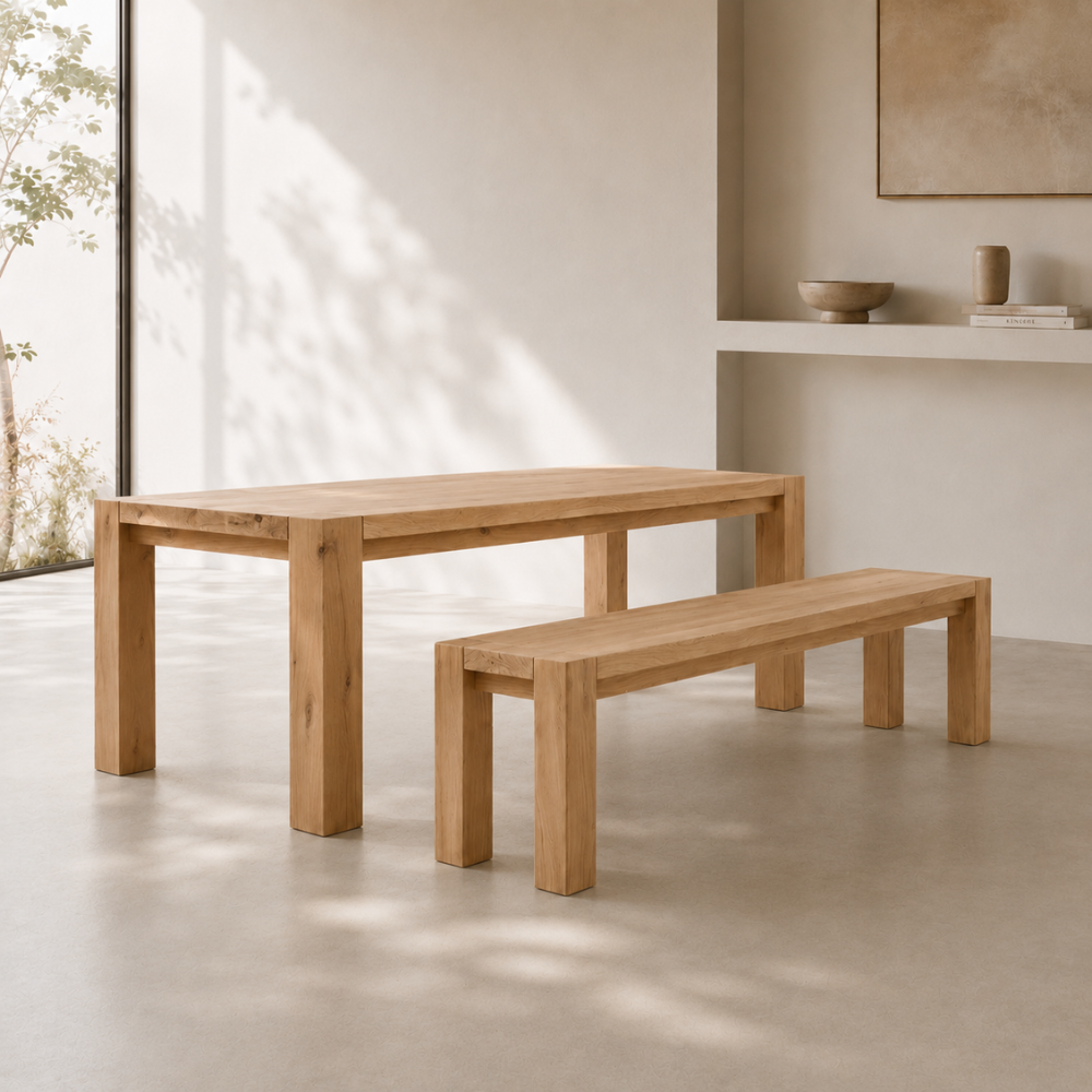 The Masai Oak Table is handcrafted from solid sustainably sourced oak with architectural cant-style legs and natural timber character. Made to order in SA.