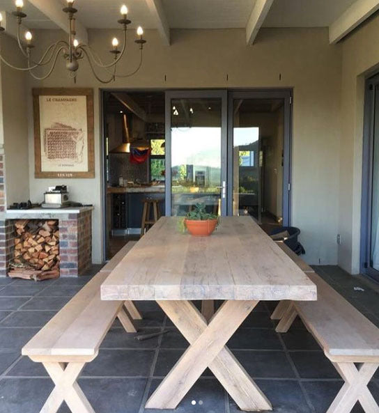 Custom made oak dining room table with cross legs design and benches.