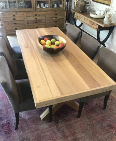 Custom made oak dining room table with cross legs design.