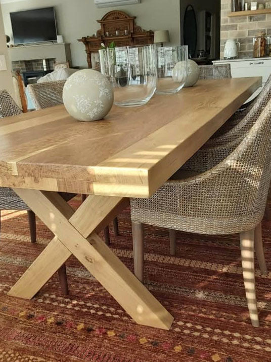 Custom made oak dining room table with cross legs design.