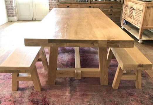 Custom made oak dining room table with A legs design and benches.