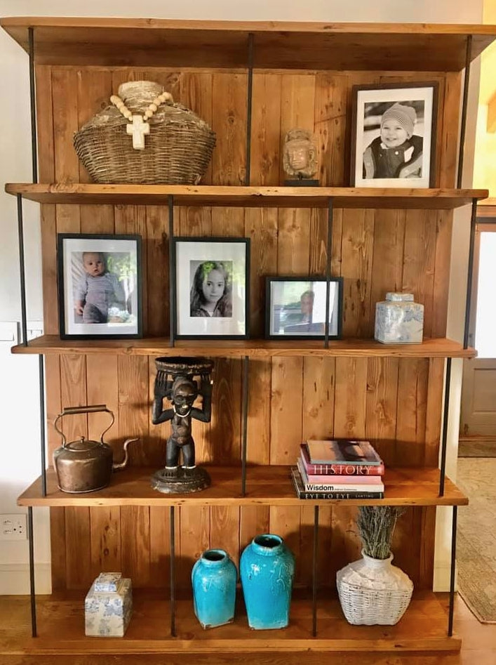 Custom made oregon Shelf with black metal rods for support. 