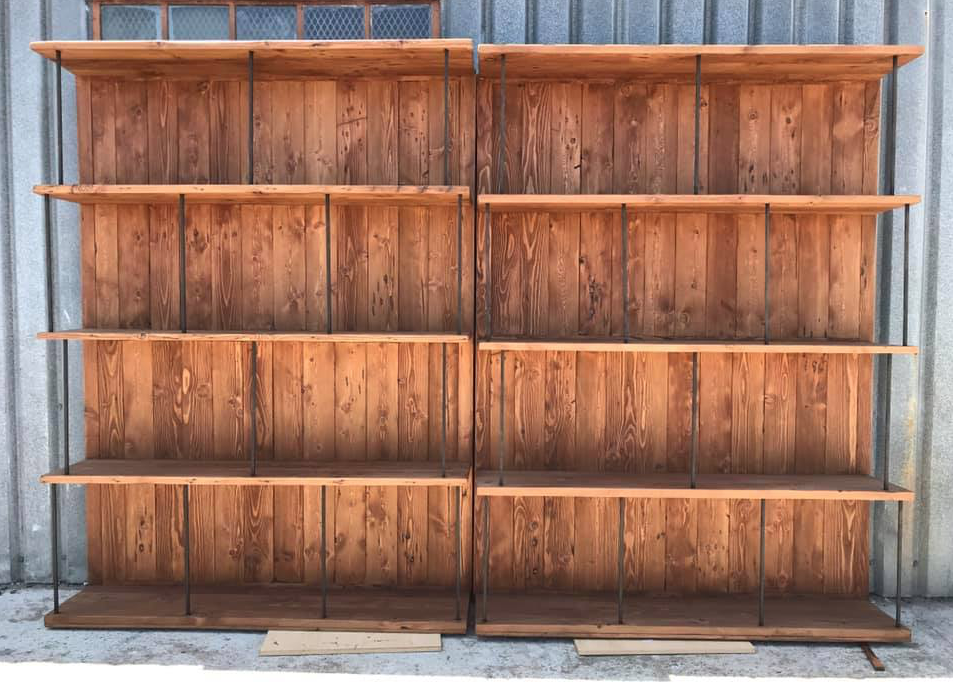 Custom amde oregon shelves with black metal support rods.