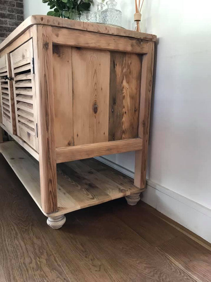 Custom made oregon cabinet with slatted cupboards and below storage space.