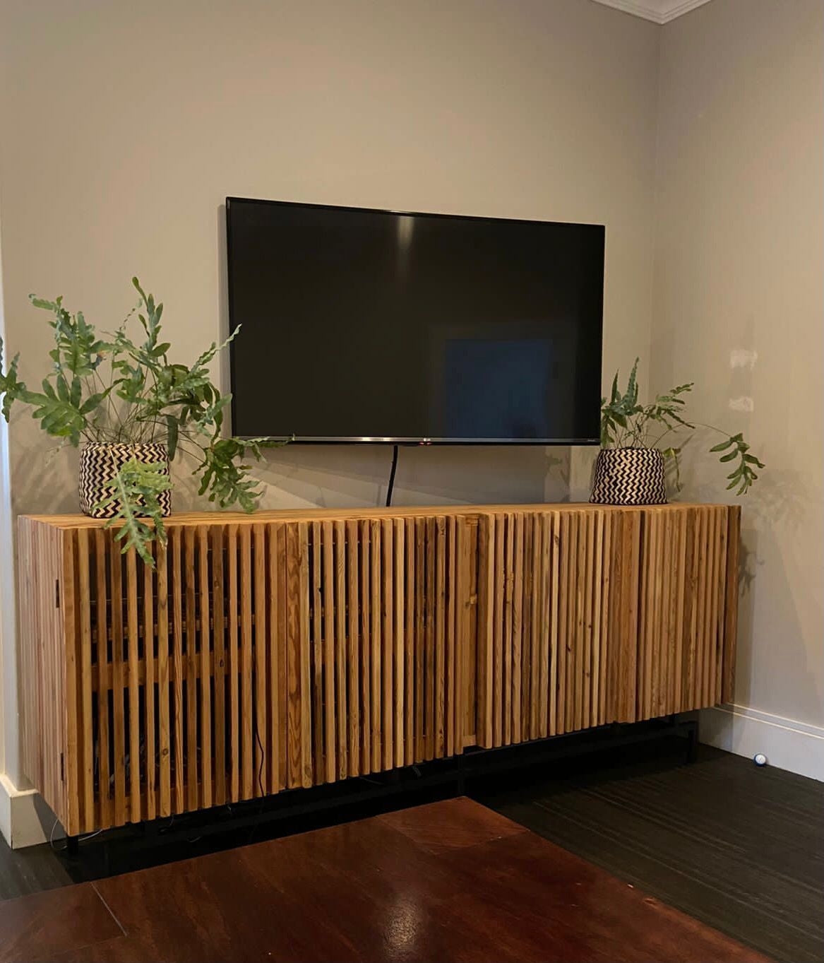 Custom made oregon TV unit with slatted cupboards.