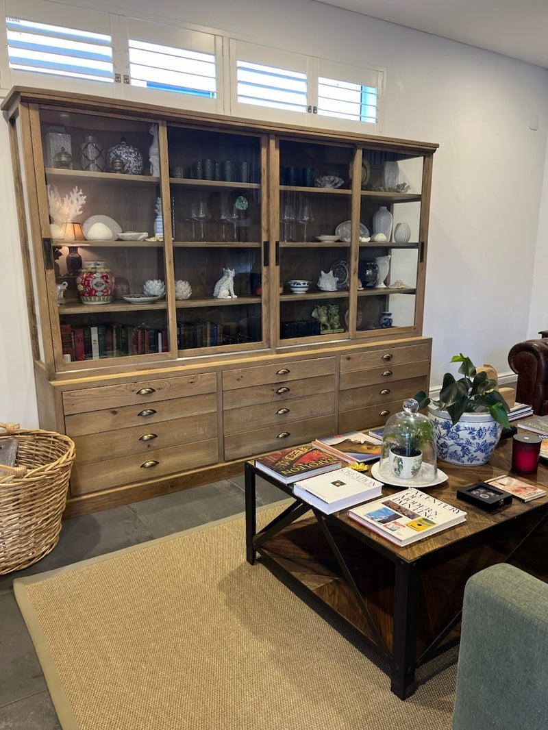 Large Custom Made Wooden Cabinet with sliding wooden doors and multi-draw compartment space.