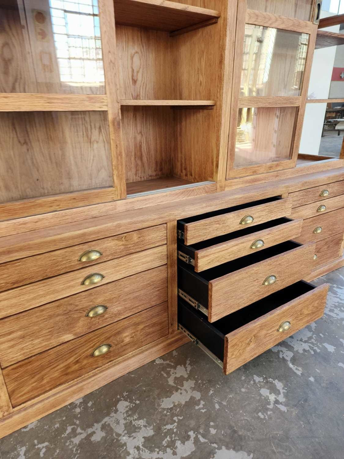 Large Custom Made Wooden Cabinet with sliding wooden doors and multi-draw compartment space.
