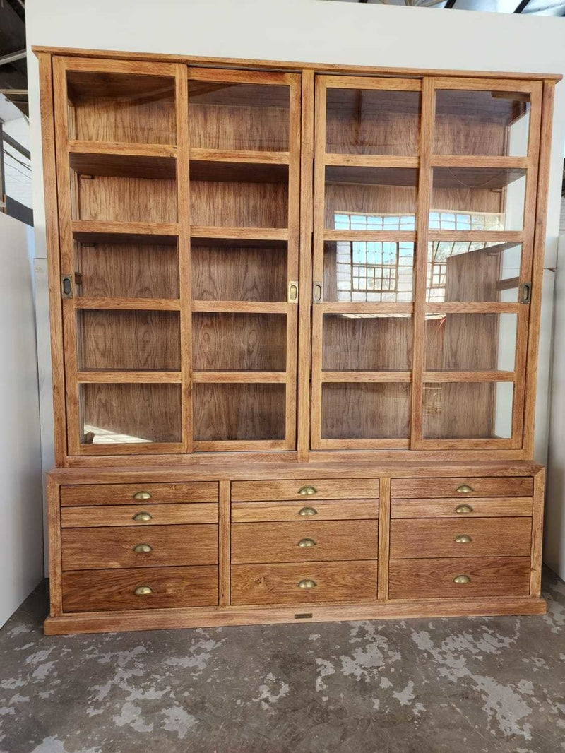 Large Custom Made Wooden Cabinet with sliding wooden doors and multi-draw compartment space.