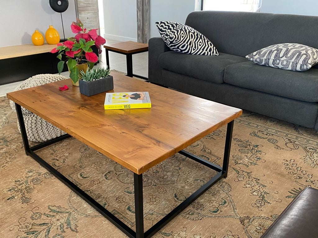Custom made wooden living room table with black metal legs.