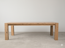 Load image into Gallery viewer, Wooden dining table against a plain white wall

