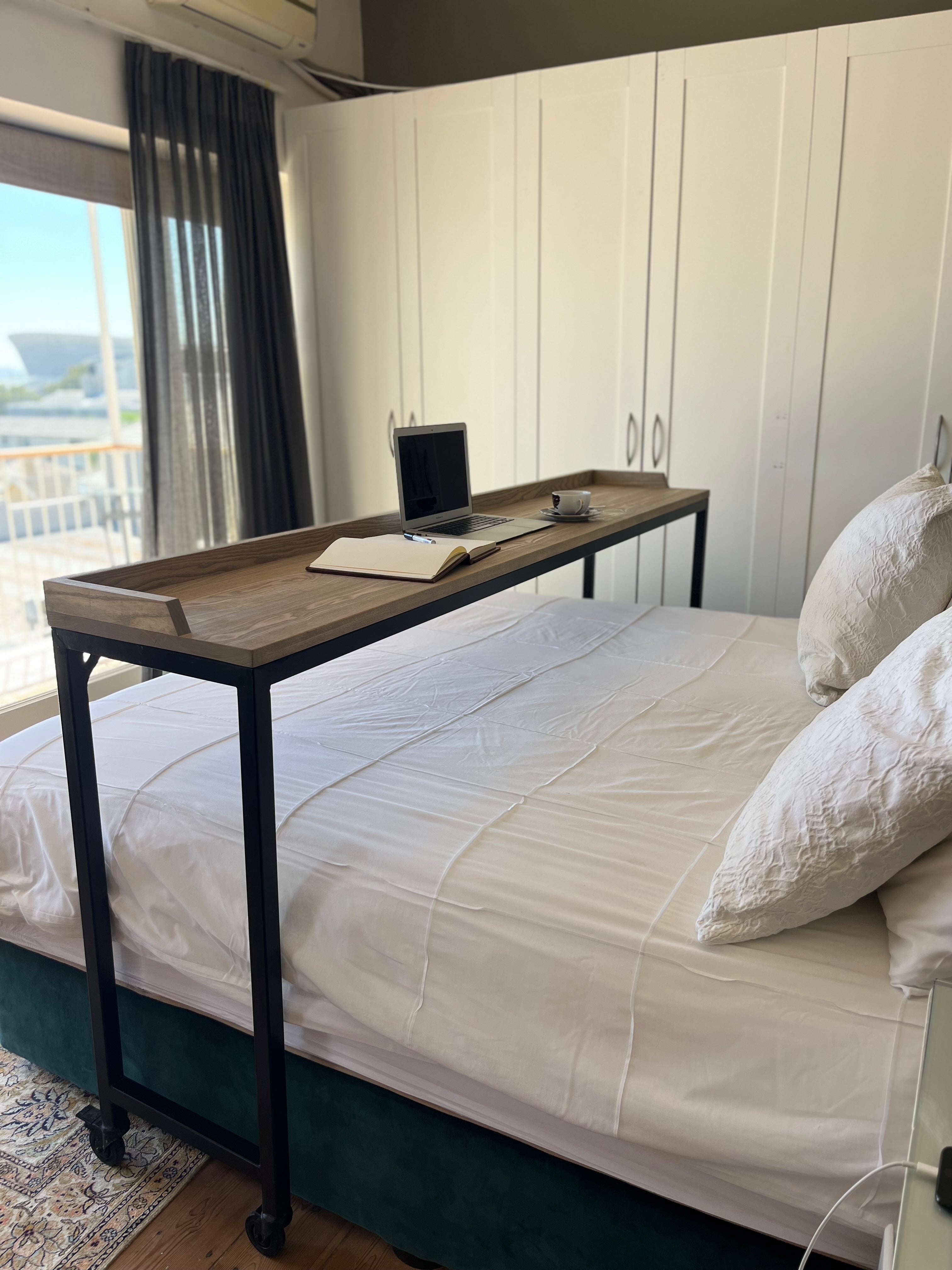 Over-bed wooden desk for work and relaxing. 