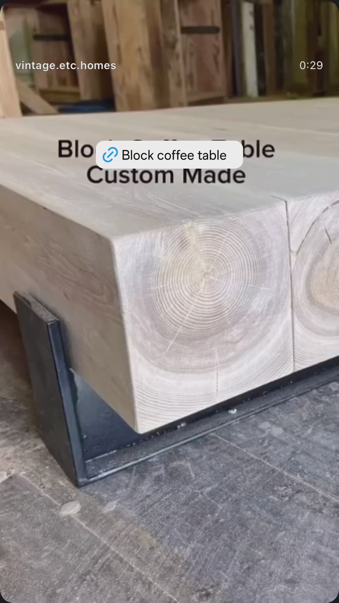 A rectangular oak wood coffee table with a visible grain pattern, sealed with a white tinted finish.