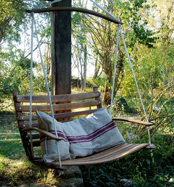The Aruba Outdoor Swing Chair is handcrafted from 100% recycled Oak wine barrel wood and marine rope. Seats two children. Built to last outdoors.