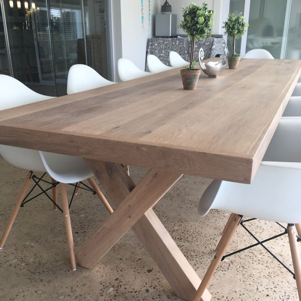 The Framed Border Cross Leg Table has a solid timber top with a framed perimeter border and a sturdy cross-leg base. Custom made to order in SA.