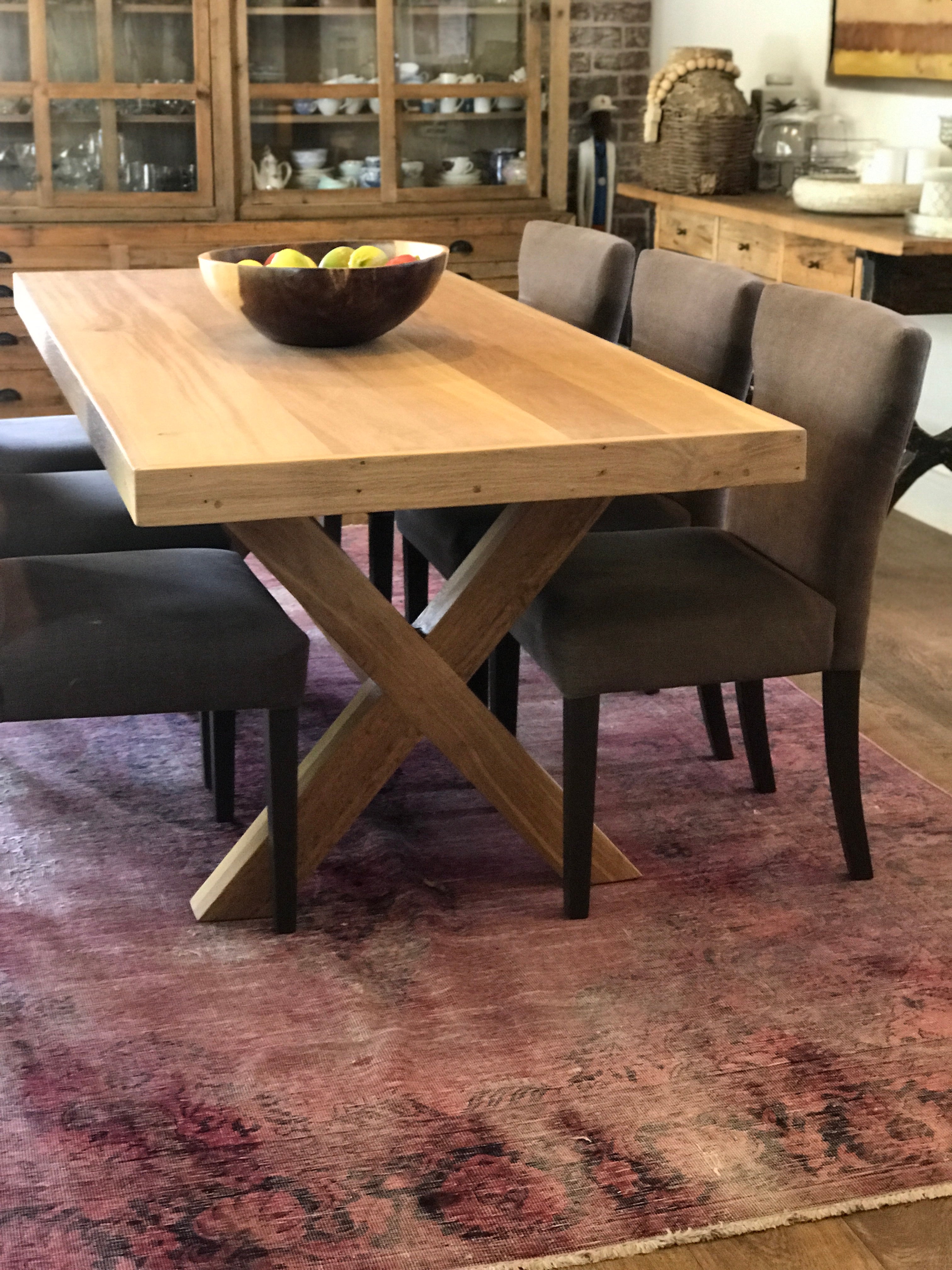 The Framed Border Cross Leg Table has a solid timber top with a framed perimeter border and a sturdy cross-leg base. Custom made to order in SA.
