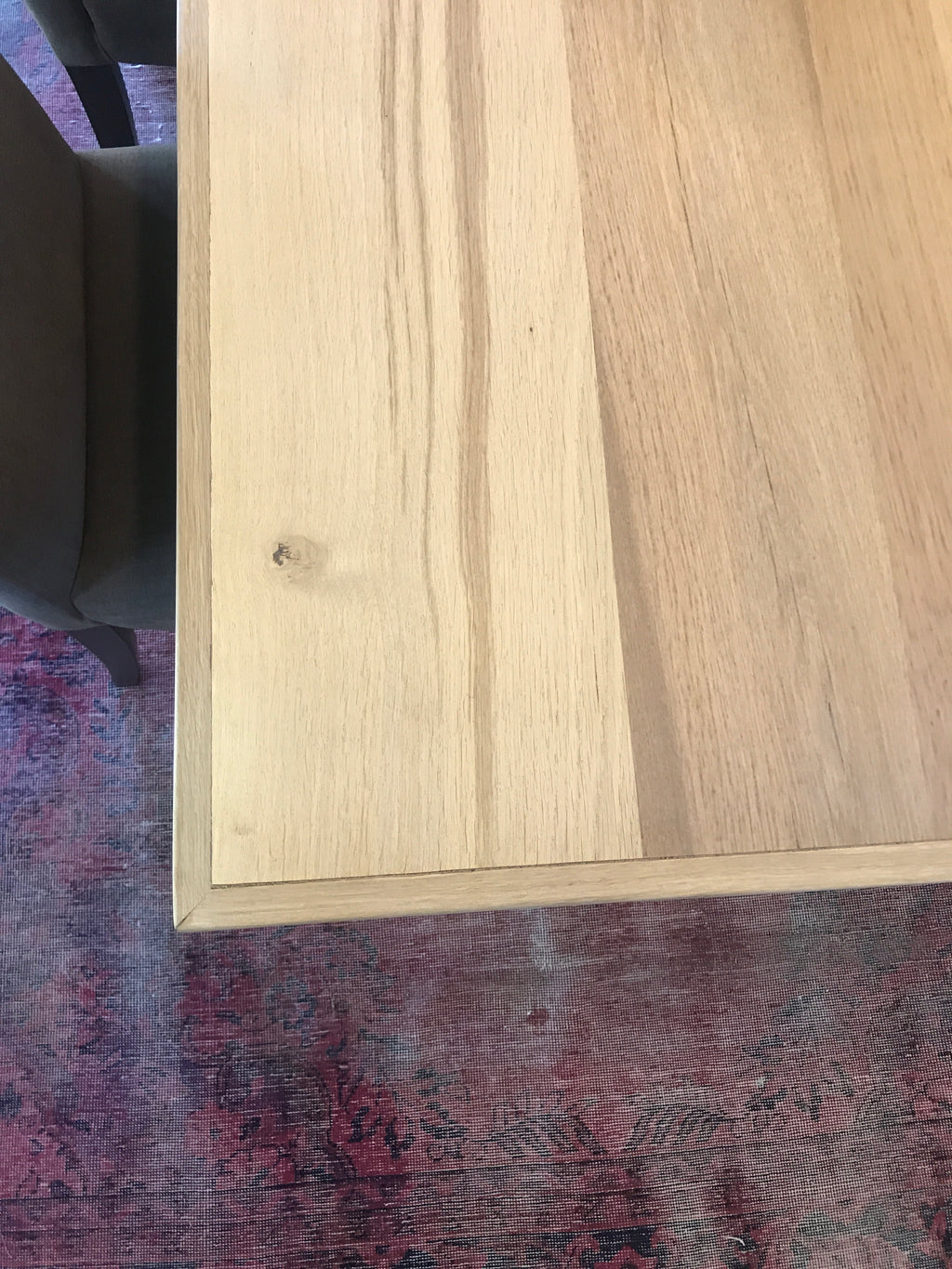 The Framed Border Cross Leg Table has a solid timber top with a framed perimeter border and a sturdy cross-leg base. Custom made to order in SA.