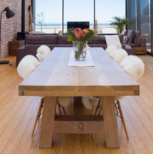 The Mandla Table features a bold solid timber top with a striking thick edge profile and clean straight legs. Custom made to order in South Africa.