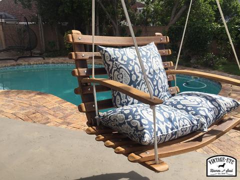 Wooden swing seat and rope outlet