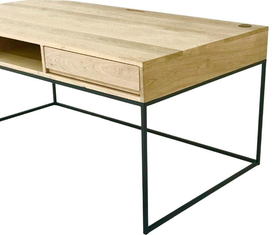 The Tiro Study Desk is custom made from Grade A Solid Oak with a central pigeon hole, two drawers, and concealed cable management. Made to order in SA.