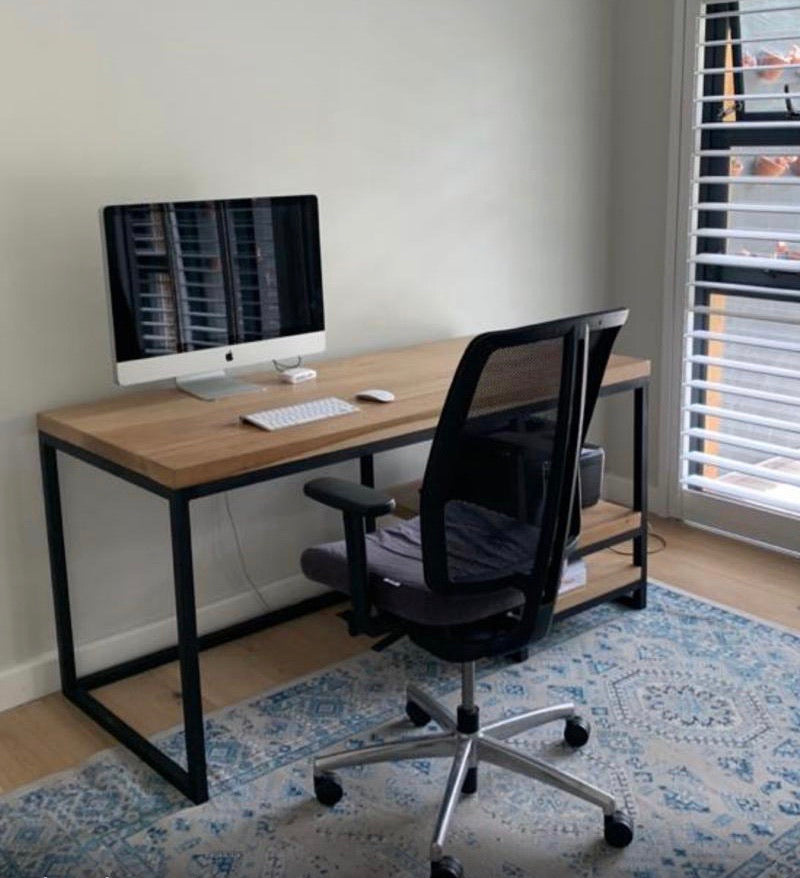The Vuyani Desk is a popular timber and tubular metal desk with integrated shelving on the left or right. Fully assembled. Custom made to order in SA.